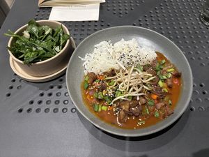 “Duck” in sweet and sour sauce and amazing spinach salad.   at Manna 2 in Warsaw