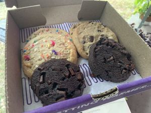 Double chocolate chip (front), birthday cake (left), and chocolate chip (right). 😋  at Insomnia Cookies in Bloomington