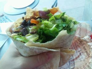 Veggie burrito (beans, rice, peppers, onions, corn, lettuce, guacamole) at Chipotle - Strada Pl in Naples