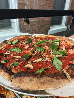 Marinara Pizza (made without cheese) with mushrooms added  at Wheated in Louisville