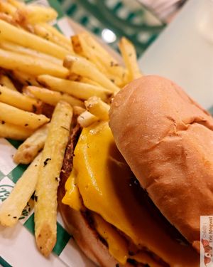 Double BBQ Burger, crushed double patty, veggie cheddar, bacon, onion ring, mayonnaise and bbq sauce in a potato bun, very good and hearty. at Neat Burger - Porta Venezia in Milan