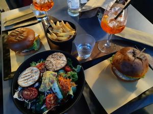 Vegan Style Burgers, Light Vegan Salad and French Fries at Aurora Cocktail Bar in Nago-torbole