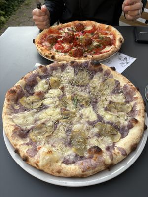 Vegan Violetta pizza made with truffled potatoes, and the nonna pizza with vegan meatballs  at VyA in Luzern