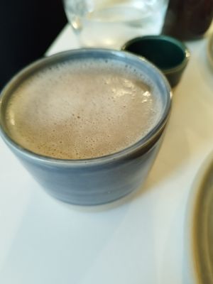Black tea with oat milk at Bistro Deppat in Vienna