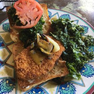 faux chicken sandwich with kale salad at Kale Cafe Vegan Kitchen in Daytona Beach