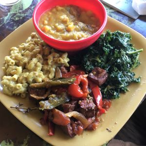 Vegan value meal with curry, Mac cheez, seiten, kale salad at Kale Cafe Vegan Kitchen in Daytona Beach