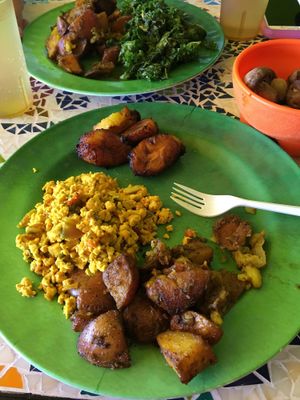 Plantains,tofu scramble, potatoes, and spicy mushrooms (in the bowl) at Kale Cafe Vegan Kitchen in Daytona Beach