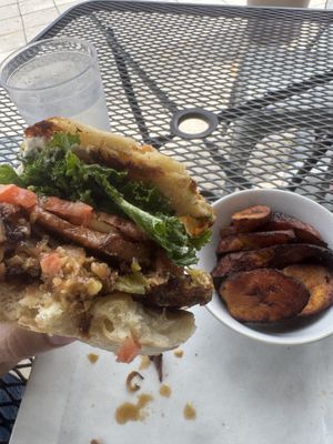 Deluxe burger.. and plantains. Party time  Excellent.   at Kale Cafe Vegan Kitchen in Daytona Beach