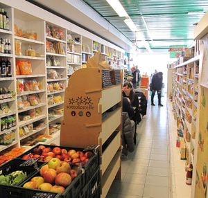 tables for eating among the shelves at NoiBio in Perugia
