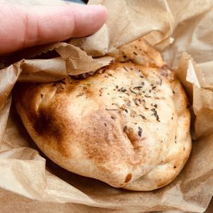 Pizza handpie  at Rainbow Bakery in Bloomington