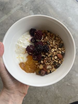 Homemade buckwheat granola with sojaskyr, saffron-apricot-jam and berries   at ela eatery in Muenchenstein