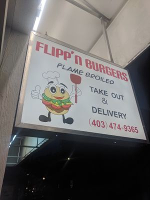 Sign outside the door at Flipp'n Burgers in Calgary