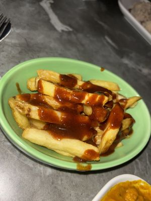 Fries with jerk sauce   at Evoden in Manchester