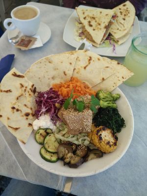 Tofu Buddha Bowl (vegan, 13,80 €) in front and a piadina (something between 7 and 9 €) in the back.
 at Soul Food in Valletta