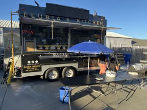 Food truck parked behind a paint store   at Elubia's Kitchen - Santa Barbara Cider Location in Goleta in Goleta