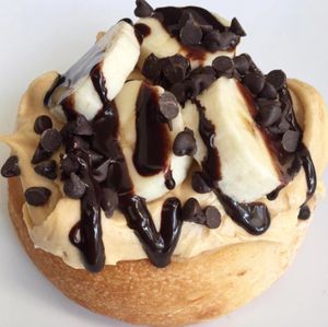 Peanut Butter Frosting with Bananas, Chocolate Chips & Chocolate Sauce! at Cinnaholic in Gretna
