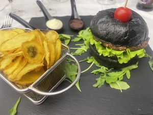 Black mamba burger with chips  at Novak in Belgrade