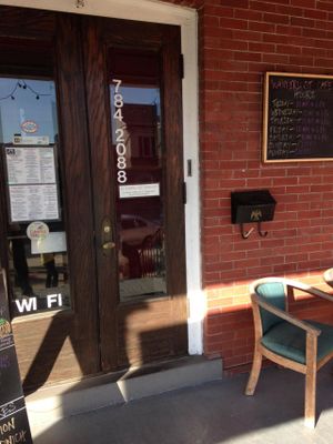 front door with menu at Wanderlust Cafe in Bloomsburg