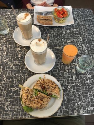 Tofu bagel, fruit juice and scrambled tofu. Latte Machiattos. at No Milk Today in Berlin