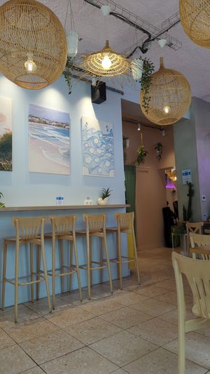 Indoor and outdoor seating at Bluebird Coffee in Rennes