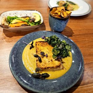 Tofu in mango purée and "caldo verde" (chopped cabbage). at Vrasserie in Porto