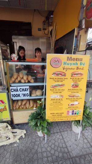The lady on the right, she always has a big smile on her face. at Bánh Mì Chay Huynh Đệ  in Hoi An
