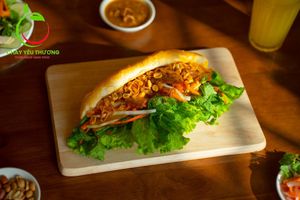 Bánh mì Hội An (the Hoi An Style)
vegan pate, vegan mayo, green vietnamese herbs, pickles, vegan charsiu, grilled seitan with vegan homemade sauce and soy sauce  at Chay Yêu Thương in Nha Trang