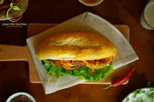 Bánh mì An vui Xá xíu (the cheerful charsiu): vegan pate, vegan mayo, lotus mocked meatloaf, mushroom mocked meatloaf, vegan charsiu, homemade sauce) at Chay Yêu Thương in Nha Trang
