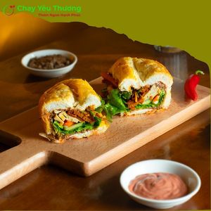 Banh mì thập cẩm Hạnh Phúc (the complete soul): vegan pate, vegan mayo, green herbs, pickles, vegan charsiu, grilled oyster mushroom, seitan, lotus & mushroom mocked meatlo at Chay Yêu Thương in Nha Trang