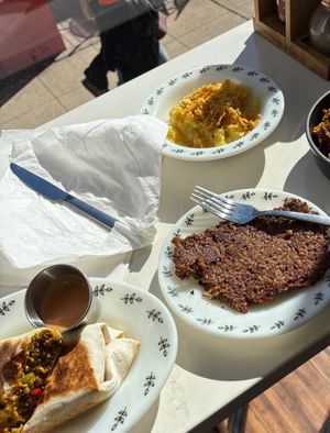 Breakfast burrito with Grippo’s aioli (lower left), side of goetta (lower right), and party potatoes (top). All of the food items were incredible. at juniper seed in Cincinnati