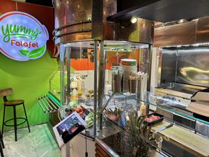 The restaurant is small but has some seating inside on tall stools   at Yummy Falafel in Oslo