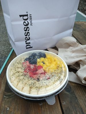 Vanilla bowl with sliced bananas, strawberries, blueberries, chopped mango, and hemp hearts. at Pressed Juicery in Philadelphia
