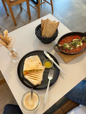 Brunch burrito, latte, and shakshuka. at Prince Peach in Berlin