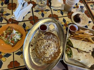avocado toast, cardamom pancakes, falafel wrap, and vegan bundt cake  at Annapurna's World Vegetarian Cafe in Santa Fe