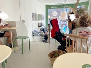 Seating upstairs: a small space and crammed. There are only 3 small tables and a larger table. The toilet is downstairs. at Tea Stories in Amsterdam