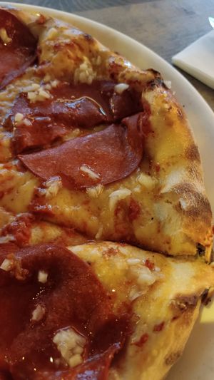 Vegan cheese and pepperoni on pizza at Vapiano - Wien Mitte in Vienna