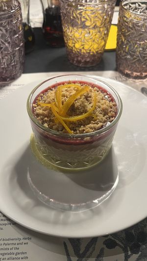 Hazelnut and chocolate panna cotta with hazelnut crumble and pomegranate sauce  at PortoCostanza - Approdo del Gusto in Palermo