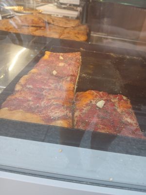 Square marinara pizza slices at Panificio Coppola Antonio in Naples