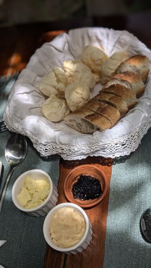 Cheese Bread and Baguette 
- accompanied with jam, vegan butter & hummus at Brunch da Mari Marola in Rio De Janeiro