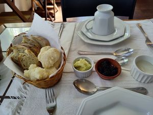 Cheese balls and bread with spreads at Brunch da Mari Marola in Rio De Janeiro