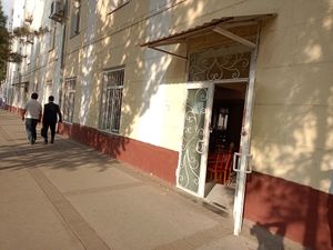 The open door from outside to find the cantine at B Blok - Tashkent University of Information Technologies in Tashkent