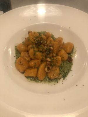 Carrot gnocchi with roasted carrots on a field rocket sauce   at La Lanterna in Verona