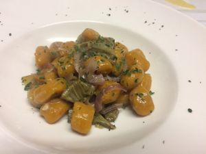 Gnocchi di zucca con cipolla, carciofi e prezzemolo at La Lanterna in Verona