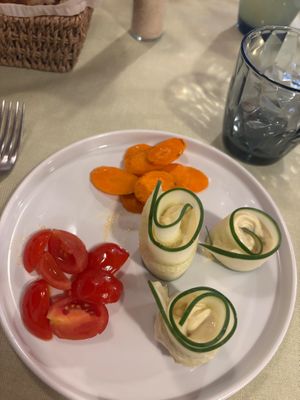 Stuffed cucumber starter with cream cheese, carrots and tomatoes at La Lanterna in Verona