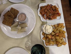 Pistachio crusted tofu, baked potatoes, and caponata at La Lanterna in Verona