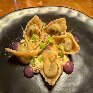 Pumpkin gnocchi 100% with fresh black truffle, vegan ricotta, sweet and sour onion, chestnuts and chamomile  at Bistro Esencia in Mallorca