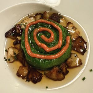 Smoked chard ensaimada stuffed with seasonal mushrooms, celery, parsley and vegan fig sobrasada  at Bistro Esencia in Mallorca