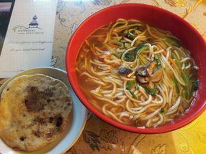 veg noodles and a red bean pancake at Happiness Vegetarian in Kathmandu