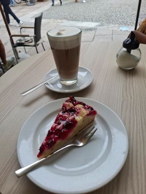 Vegan raspberry cake and Latte Machiatto with Oat Milk at Caffè Lucca in Fuessen