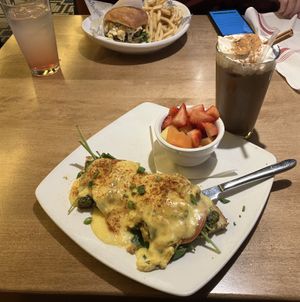 My Just egg Benedict entree and oatmilk horchata latte, and my husband’s vegan burger with fries  at Silver Diner in White Marsh